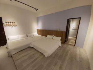 Postelja oz. postelje v sobi nastanitve Haichin&Haiting B&B
