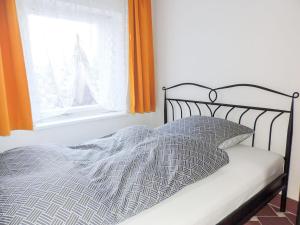 En eller flere senge i et værelse på Stilvolles Ferienhaus Artdeco