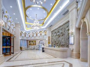 a large lobby with a chandelier in a building at Vienna Hotel(Anqing Guangcai Seven-street) in Anqing