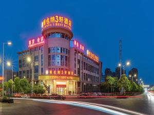 a large building with neon signs on top of it at Vienna Hotel 3 best Wuwei City south in Wuhu