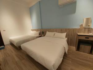Postelja oz. postelje v sobi nastanitve Haichin&Haiting B&B