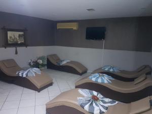 A television and/or entertainment centre at Acropol Beach Hotel