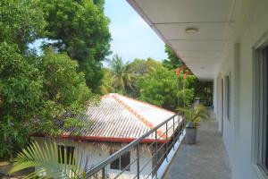Ein Balkon oder eine Terrasse in der Unterkunft D'Villa Garden House