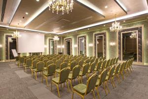 a conference room with a row of chairs and a screen at Limak Eurasia Luxury Hotel in Istanbul +37 photos