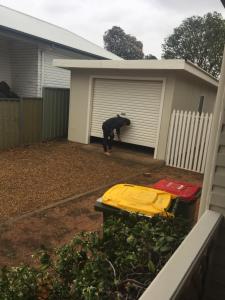 a man standing in front of a garage at Fitzroy haven in Dubbo