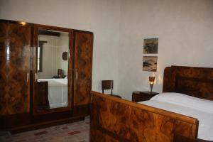 
A bed or beds in a room at Il Gesuita
