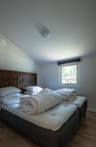 Säng eller sängar i ett rum på Kolleviks Camping och Stugby
