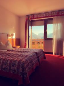 Postel nebo postele na pokoji v ubytování Gardenhotel Premstaller