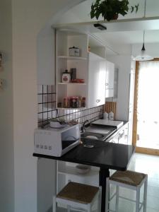 A kitchen or kitchenette at Casa Baleari 28C