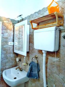 a bathroom with a sink and a mirror at Apartment Mediterraneo Blue Sky in Perast