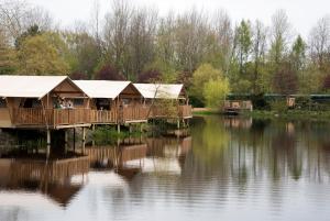 a lake with a couple of boats in it at Serengeti Park Resort in Hodenhagen