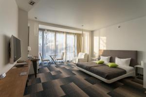 Ένα ή περισσότερα κρεβάτια σε δωμάτιο στο "7 terrass" бутик-отель