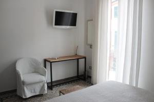 TV a/nebo společenská místnost v ubytování CAMERA GIGLIA + 12 fotografií