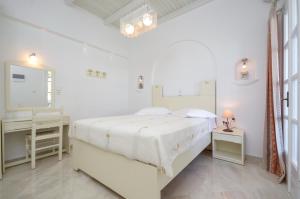 Postel nebo postele na pokoji v ubytování Hotel Anixis