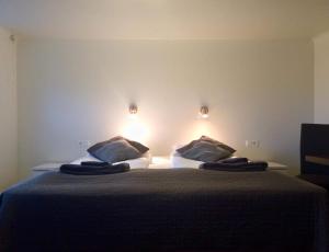 Letto o letti in una camera di Guesthouse Carina