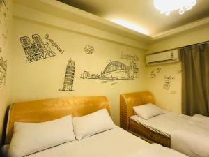 Postel nebo postele na pokoji v ubytování Love Feng Jia Apartment Hotel