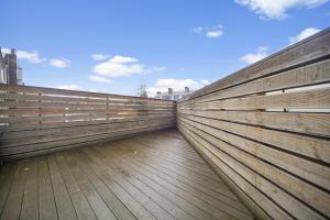 a view of a wooden boardwalk with the sky in the background at Executive Apartments in Central London Euston FREE WIFI City Stay Aparts London in London