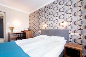Posteľ alebo postele v izbe v ubytovaní Hotel Mazowiecki Łódź