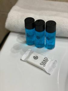 two bottles of glue sitting on top of a towel at Catedral Boutique in Seville +25 photos
