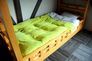 Voodi või voodid majutusasutuse Sakura Guest House toas