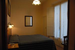 Postel nebo postele na pokoji v ubytování Hotel Margaret