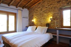 מיטה או מיטות בחדר ב-Finca Las Abubillas