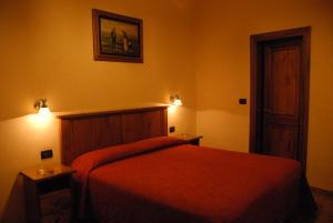 Postel nebo postele na pokoji v ubytování Hotel Margaret