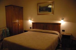 Postel nebo postele na pokoji v ubytování Hotel Margaret