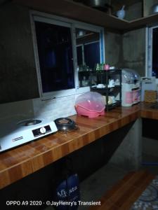 a counter in a kitchen with a counter top with a counter top at Jay Henry Transient Beach house, B Pagudpud, BLUE LAGOON BEACH in Pagudpud