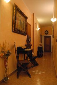 a room with a desk and a picture on the wall at Hotel Margaret in Florence