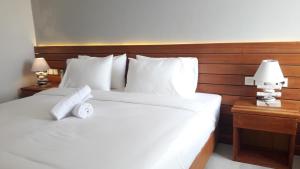 Letto o letti in una camera di Mantra Gili