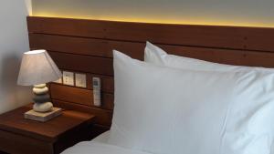 Letto o letti in una camera di Mantra Gili