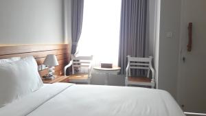 Letto o letti in una camera di Mantra Gili