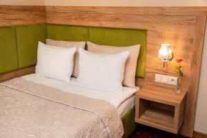Łóżko lub łóżka w pokoju w obiekcie Grein Hotel