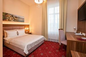 Łóżko lub łóżka w pokoju w obiekcie Grein Hotel