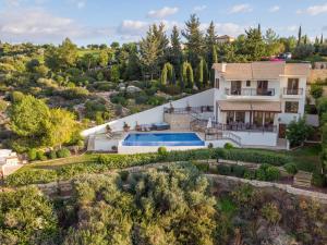 an aerial view of a house with a swimming pool at Villa HERMIONA in Kouklia