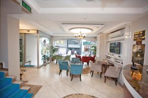 a restaurant with a dining room with tables and chairs at Hotel Bulvar Istanbul in Istanbul