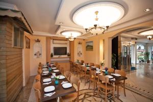 a restaurant with tables and chairs in a room at Hotel Bulvar Istanbul in Istanbul