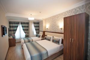 Postel nebo postele na pokoji v ubytování Hotel Bulvar Istanbul