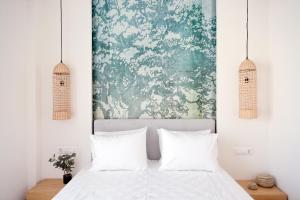 Postelja oz. postelje v sobi nastanitve Odyssey Residence