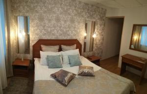 Cama o camas de una habitación en Hotel Vityaz