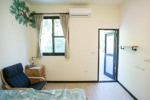 Postel nebo postele na pokoji v ubytování Tree House Café & Homestay