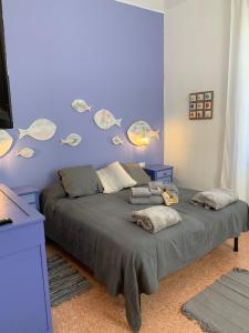 En eller flere senge i et værelse på Violetta Portofino by PortofinoVacanze