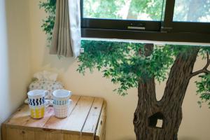 Fotografie z fotogalerie ubytování Tree House Café & Homestay v destinaci Tongluo