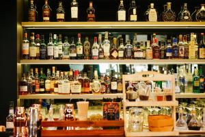 a bar filled with lots of bottles of alcohol at Crowne Plaza Berlin City Centre Ku'damm by IHG in Berlin