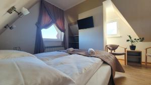 Postel nebo postele na pokoji v ubytování Czerwone Wierchy - sauna i jacuzzi wliczone w cenę pobytu!