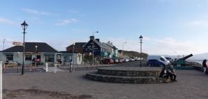 a group of people sitting in a parking lot at Surfers Getaway - Room Staycation in Sligo