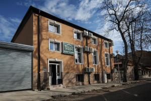 un edificio con un cartel en el costado en Best Rest Guest Rooms en Plovdiv