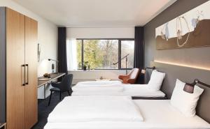 Letto o letti in una camera di Comwell Kolding