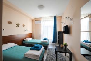 TV a/nebo společenská místnost v ubytování Best Rest Guest Rooms
